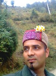 me wearing traditionl hill cap