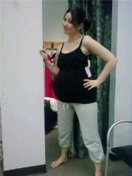 Trying on maternity clothes