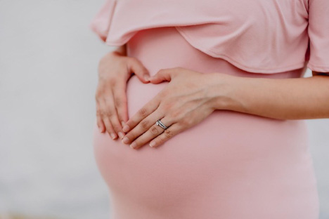 Pregnant woman in pink